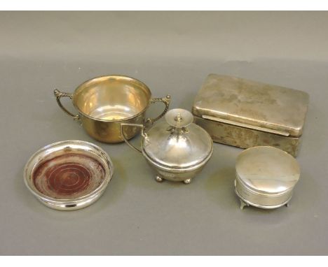 A group of silver items, a burner, Birmingham 1921, a bowl, Birmingham 1929, a dressing table box, Birmingham 1920, a coaster