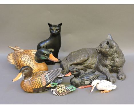 The Lying Cat, modelled in clay, cast into cast stone, whiskers made by piano wire, number 5/8, 43cm long, a Poole pottery 'V