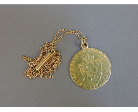 A George III gold spade guinea, 1787, with soldered suspension ring and gold chain