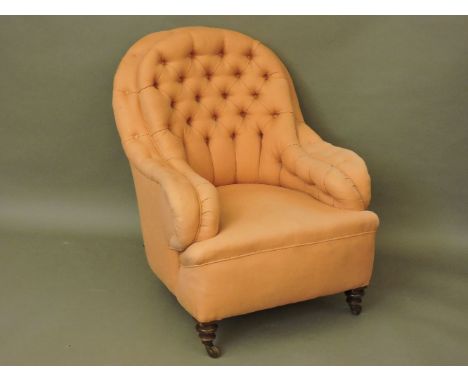 A Victorian button back armchair