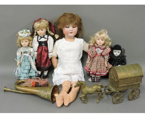 A Simon & Halbig bisque head doll, other modern dolls, a bugle, and a horse and caravan