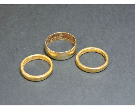 Two 22ct gold wedding rings, 10.3g approximately, and a 9ct gold wedding ring, 3.4g approximately