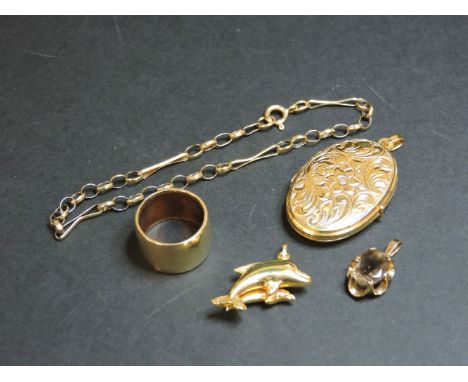 A 9ct gold oval locket, a dolphin charm marked 375, a 9ct gold smokey quartz pendant, a 9ct gold belcher bracelet, and a 9ct 