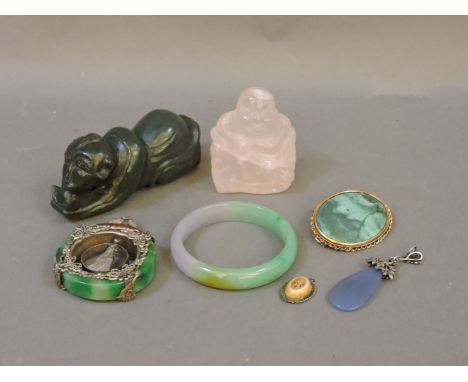 A rose quartz Buddha, hard stone figural pen rest, hard stone bangle, gold mounted brooch, pendant, Chinese miniature bone pe