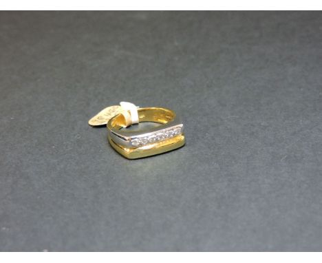 A gentleman's 18ct yellow and white gold diamond set signet ring