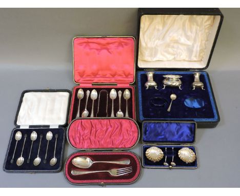 A pair of shell shape silver salts, with matching spoons, a pair of silver pepperettes and matching salt, a christening spoon