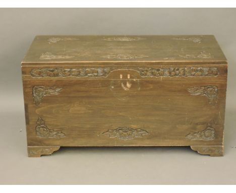 A Chinese carved camphor wood trunk, 106cm