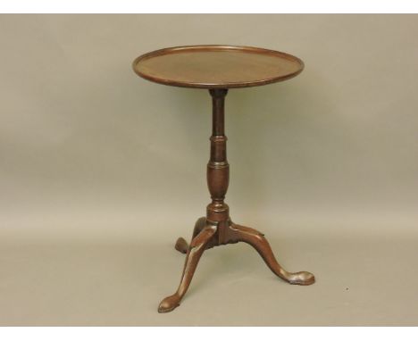 A George III mahogany lamp table, with a circular top, on a tripod base, 51cm diameter