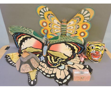 Two boxes of paper kites, rugs, curtains, etc