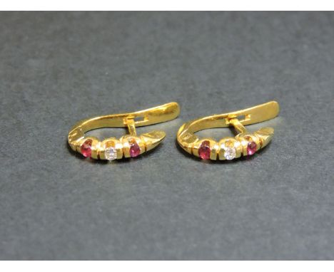 A pair of 18ct gold ruby and diamond hinged hoop earrings