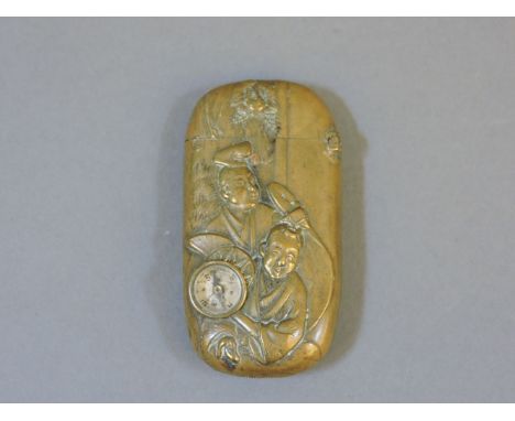 A Japanese novelty vesta, embossed with figures to each side, inset with a compass