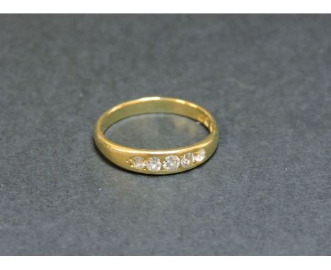 An 18ct gold five stone diamond ring