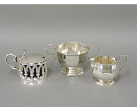 A Henry Williamson & Co silver mustard pot, Sheffield 1839, with blue glass liner, a silver sucrier, and a cream jug