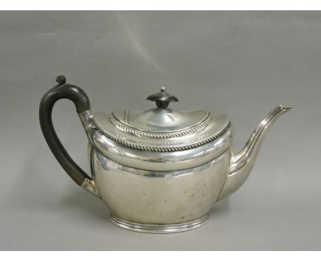 An Edward VII silver teapot, Atkin Brothers, Sheffield 1909, with gadrooned borders, and ebony handle and knop, 16.5cm handle