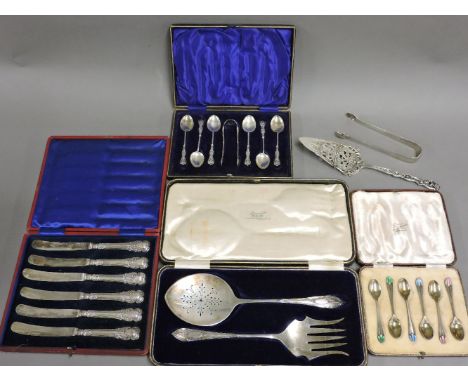 A cased set of fish servers, Sheffield 1913, a cased set of Kings pattern silver teaspoons and silver tongs, a cased set of s