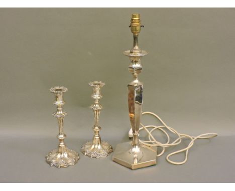 A modern silver plated weighted table lamp, 47cm high, and a pair of George III style silver plated weighted candlesticks, 25