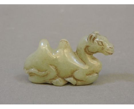 A Chinese jade brush rest, modelled as a camel