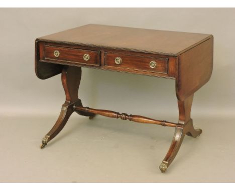 A Georgian mahogany sofa table, with two drawers and two faux drawers