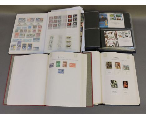 Four albums of postage stamps, one with approximately seventy-four first day covers mostly GB 1965-1970, the second with appr