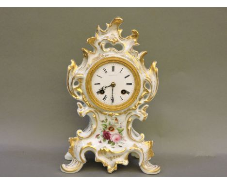 A French porcelain mantel clock, white ground with hand painted floral decoration and gilt detail with white enamel Roman num
