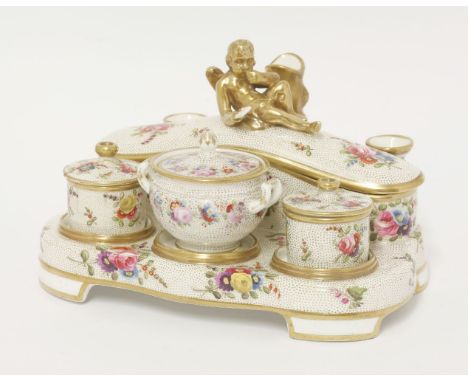 A Spode Inkstand,early 19th century, having three quill holders, a rectangular pen box, the lid with a gilt cherub handle, an