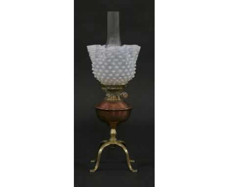 A Benson brass and copper oil lamp,with four curved legs, one stamped 'Benson', copper reservoir and Hinks No. 2 duplex burne