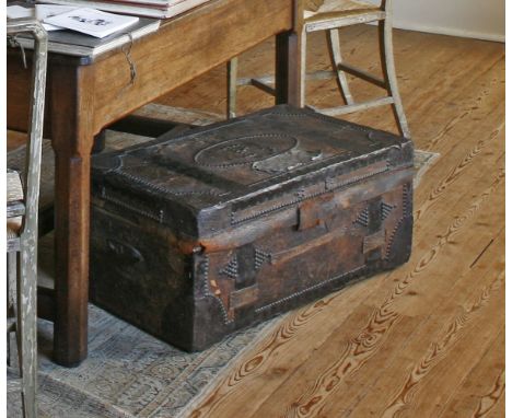 A Regency leather bound trunk of East Kent Militia interest,with studwork bands and metal mounts, the lid interior ink inscri