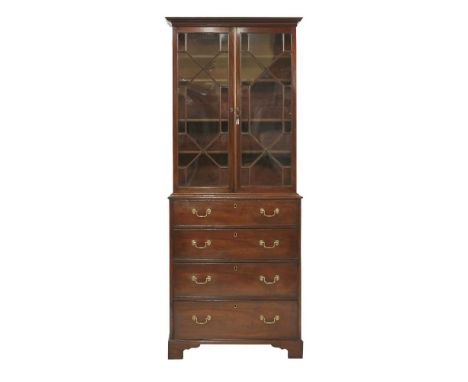 A George III mahogany glazed bookcase,of slender proportions, the glazed top enclosing four shelves, over four graduated draw
