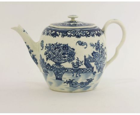 A Worcester blue and white printed Teapot and Cover,c.1785, of barrel shape with a flat cover, printed in 'The Bat' pattern w