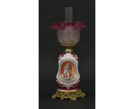 A Victorian porcelain oil lamp,with classical figural panels, on fancy gilt metal base, with Messenger's No. 2 patent duplex 