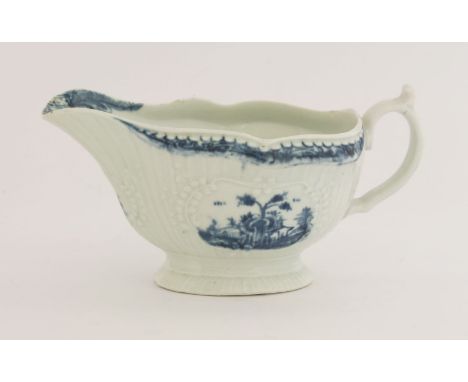 A rare Worcester blue and white Sauce Boat,c.1758-1765, the press moulded body with strapwork and cartouches painted in 'The 