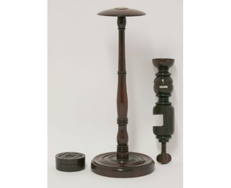 Three treen items, a George III wig stand with applied mother-of-pearl roundel,37cm high,an incomplete rosewood 'Swift', anda