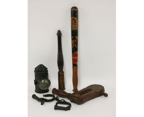 A police truncheon, 19th century, painted with a crown over an ornate 'VR' and 'POLICE', with ribbed handle,44cm long,a pair 