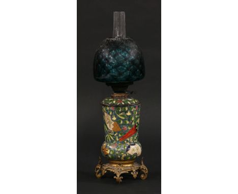 A Victorian pottery oil lamp,decorated in 'Oriental' style with fancy gilt brass base, with lift-out reservoir and moulded la