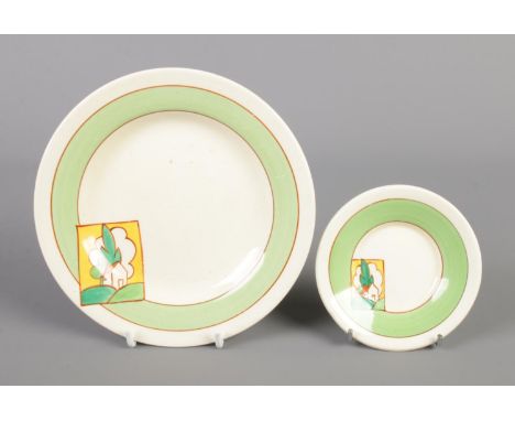 A Wilkinson Ltd Clarice Cliff Bizarre Honeyglaze side plate decorated in the Stroud design, along with a matching saucer. The