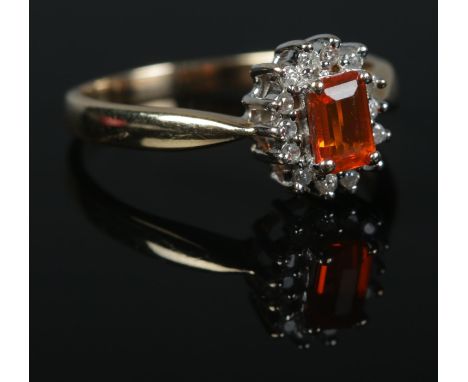 A 9ct Gold, fire opal and diamond cluster ring. Size R. Total weight: 2.9g  