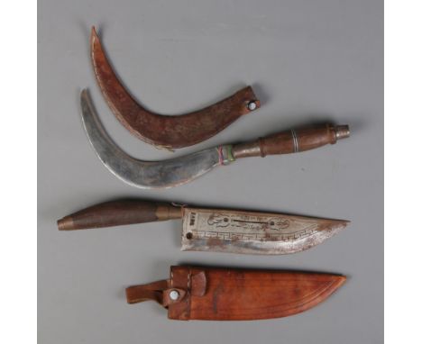 Two antique weapons/tools. A knife with wooden handle and leather sheath along with a similar sickle. CANNOT POST OVERSEAS.  