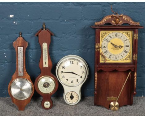 Two quartz clocks, one with timer, together with two modern barometers, one produced by Shortland, Manchester.  
