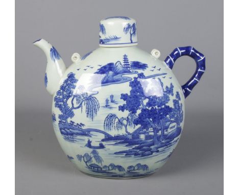 A very large twentieth century Chinese blue and white transfer printed teapot, with cover. 33cm high.  