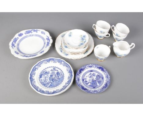 A Colclough Nigella patterned tea service along with quantity of blue and white plates depicting oriental scenes.  