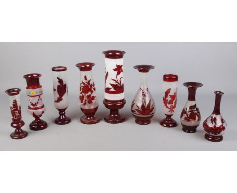 A quantity of ruby and opaque glassware, mainly vases, including one floral example.  