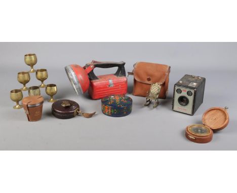 An assortment of collectables, to include Kodak Brownie I camera, tape measure, Space Ray lamp and drinking glasses etc.  