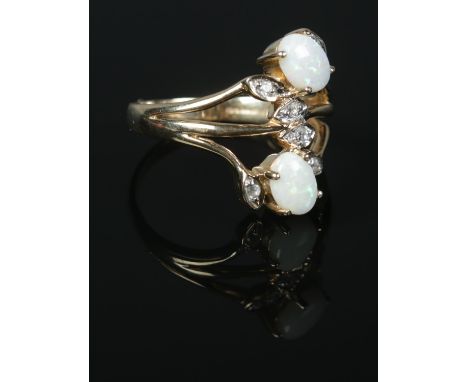 A 9ct Gold opal and white sapphire dress ring. Size TÂ½. Total weight: 4.4g  