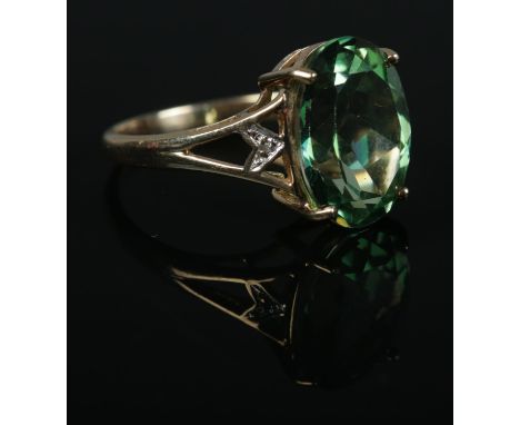 A 9ct Gold, large green stone and diamond accent dress ring. Size P. Total weight: 3.7g.  