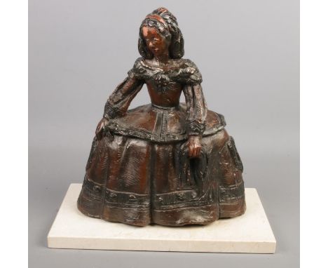 A terracotta sculpture modelled as a Georgian lady with crinoline dress on marble base. Signed M Luque. Height 30.5cm.  