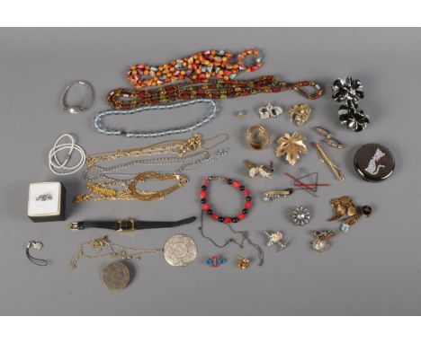 A quantity of costume jewellery including necklaces, bracelets, Accua wristwatch and, possibly silver, skull ring.  