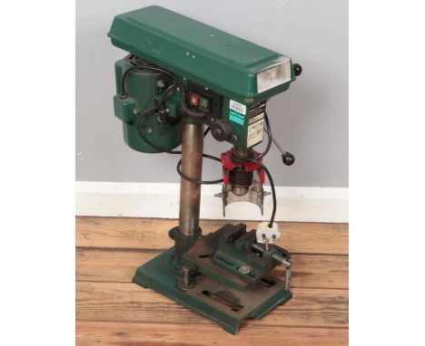 A Parkside table top pillar drill. Model No PTBM500.  Large piece missing to front of base.