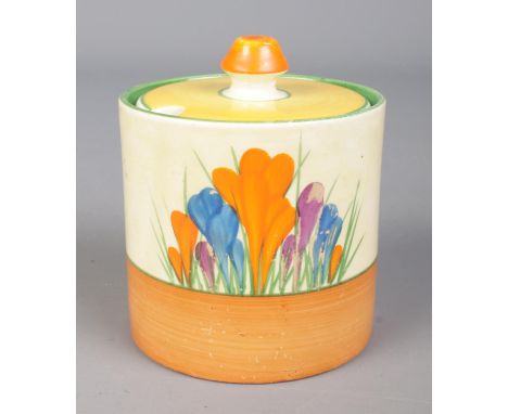 A Newport Pottery Clarice Cliff Bizarre preserve pot and cover decorated in the Crocus design. 9cm.  No chips cracks or repai
