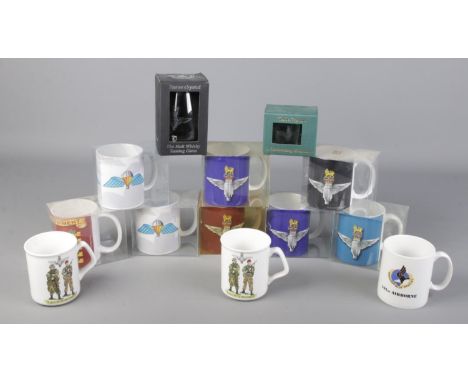 A box of ceramic and crystal mugs with military insignias, mostly Parachute Regiment.  