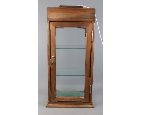 A lockable three tier display cabinet, with glass shelves and built in light. 75cm high.  